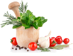 a mortar and pestle with fresh spices, garlic and tomatoes.